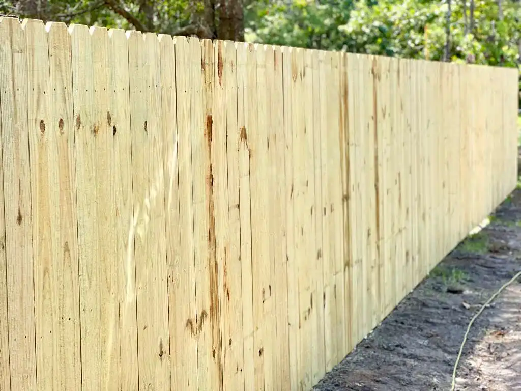 Close-up of a new unpainted cedar wood privacy fence
